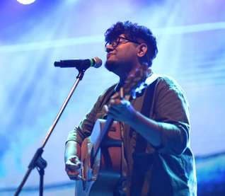 A guitarist performing live at the festival