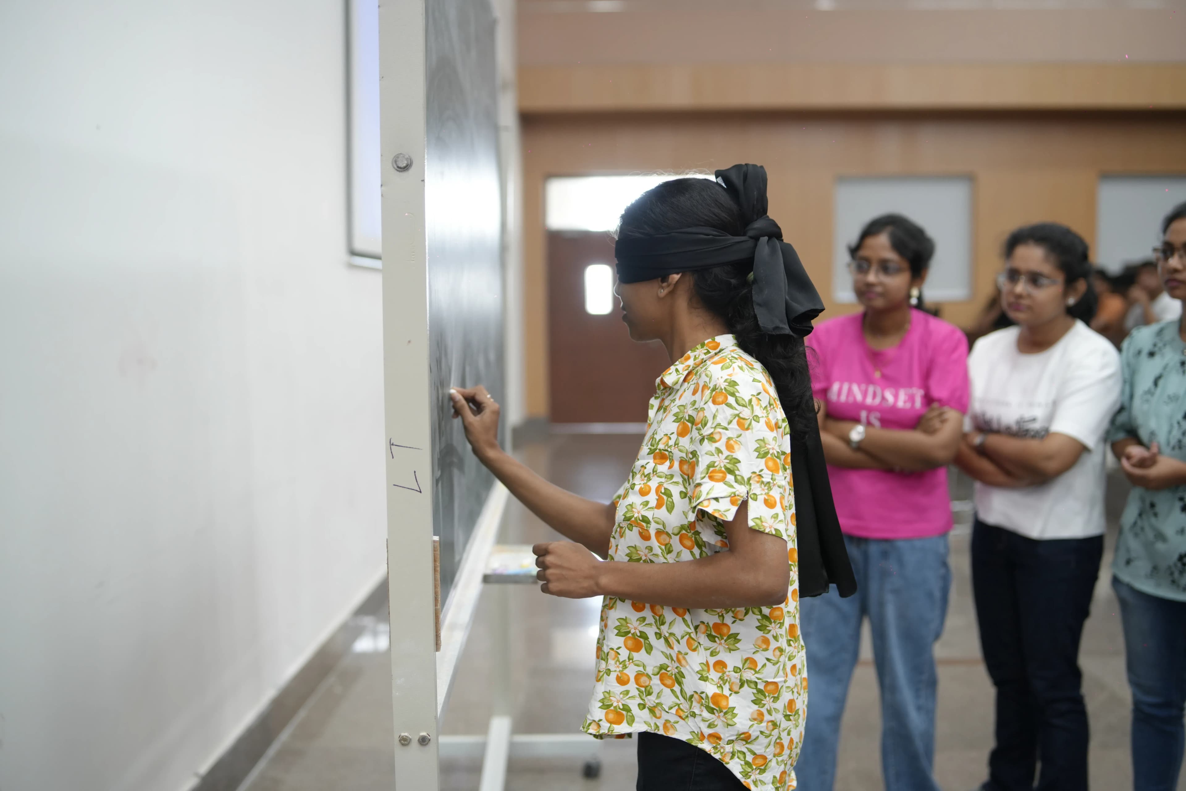 An artist sketching a portrait during an art activity